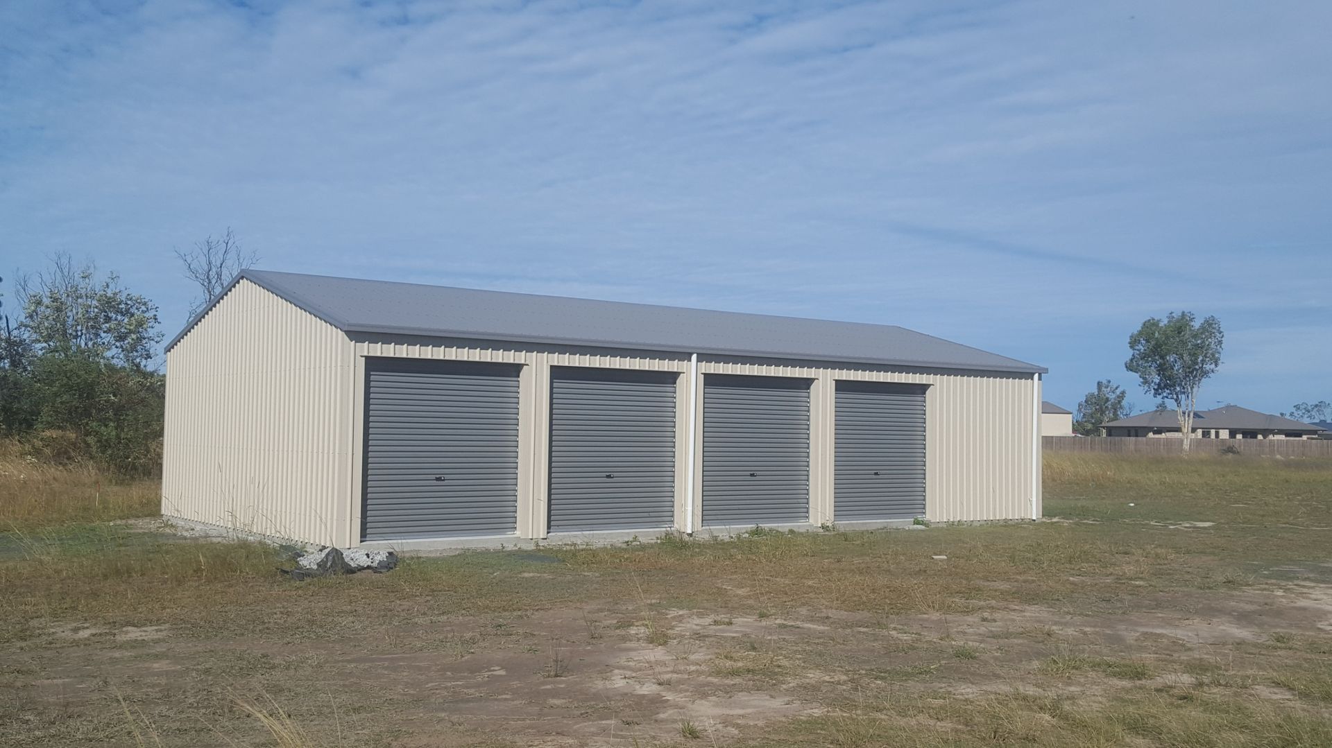 A Wooden Table Is Being Built In A Garage — Bushman Sheds in Bundaberg East, QLD