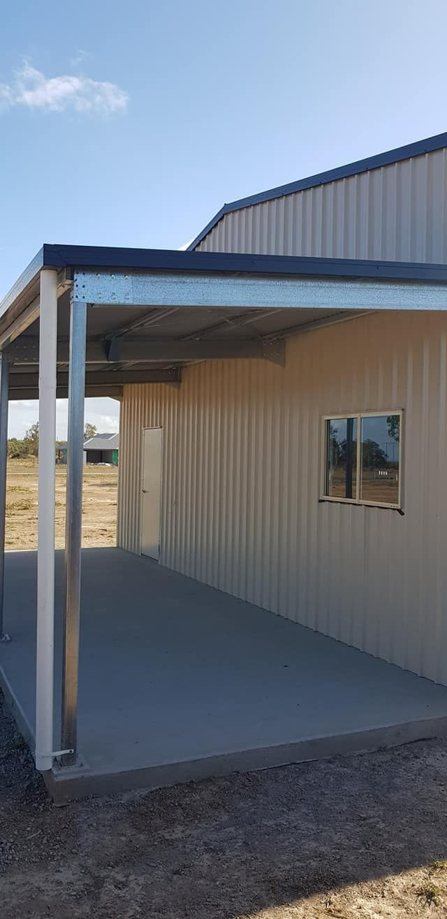 A Metal Shed With A Covered Walkway And A Window — Bushman Sheds in Bundaberg East, QLD
