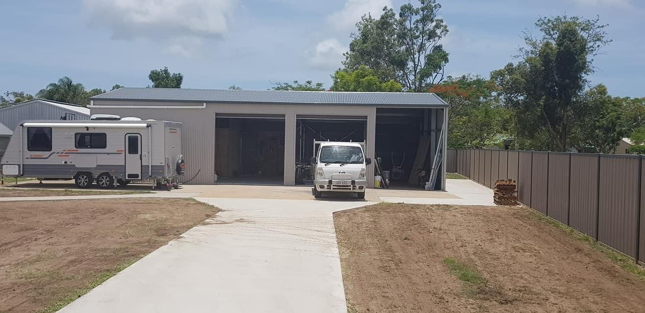 A White Van Is Parked In Front Of A House — Bushman Sheds in Bundaberg East, QLD