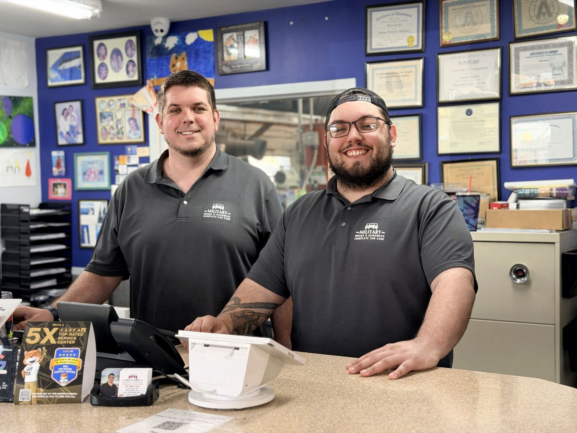 Two people smiling | Military Brake & Alignment Services Inc. 