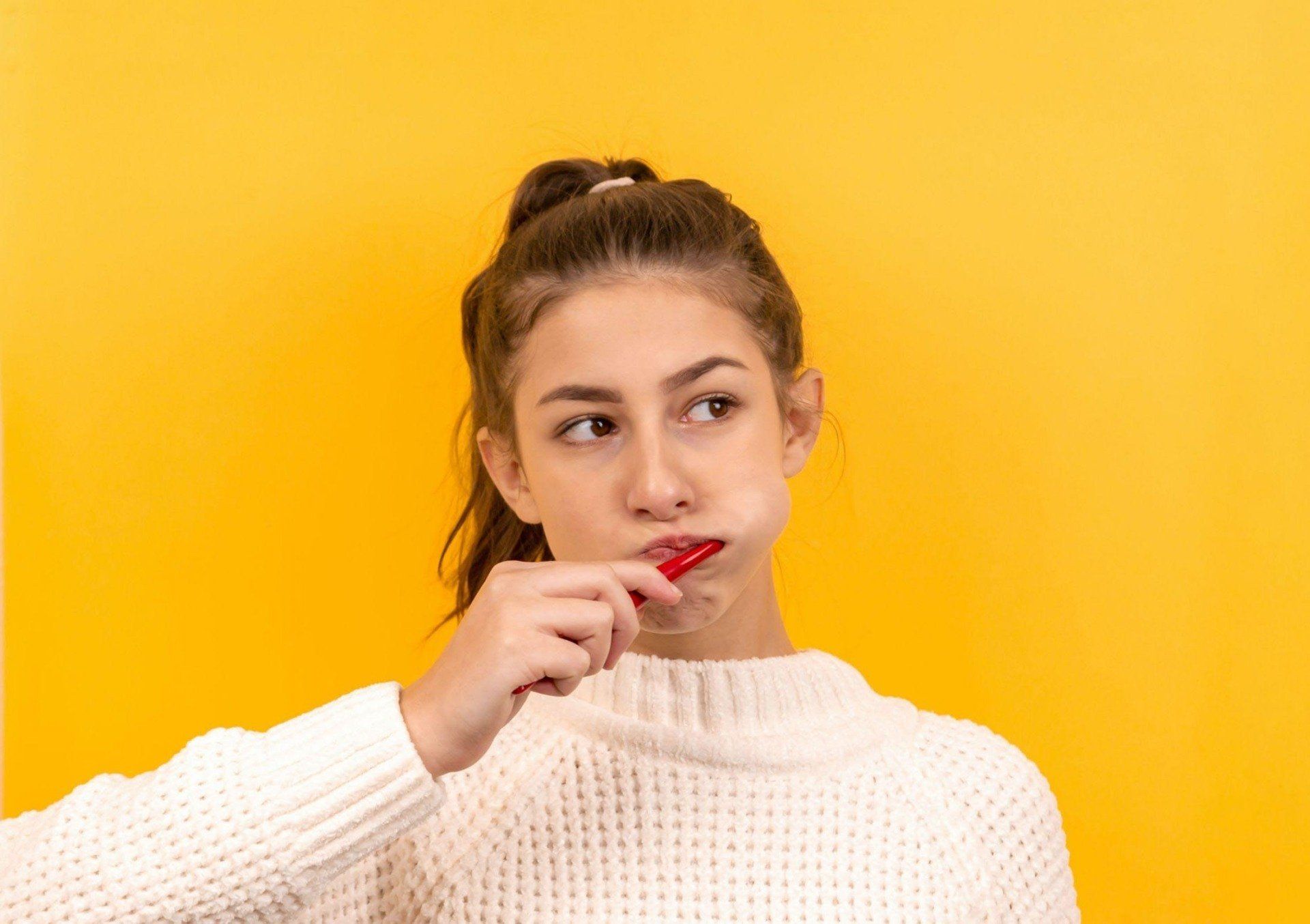 Woman Brushing Her Teeth — Dentistry Services in Cairns, QLD