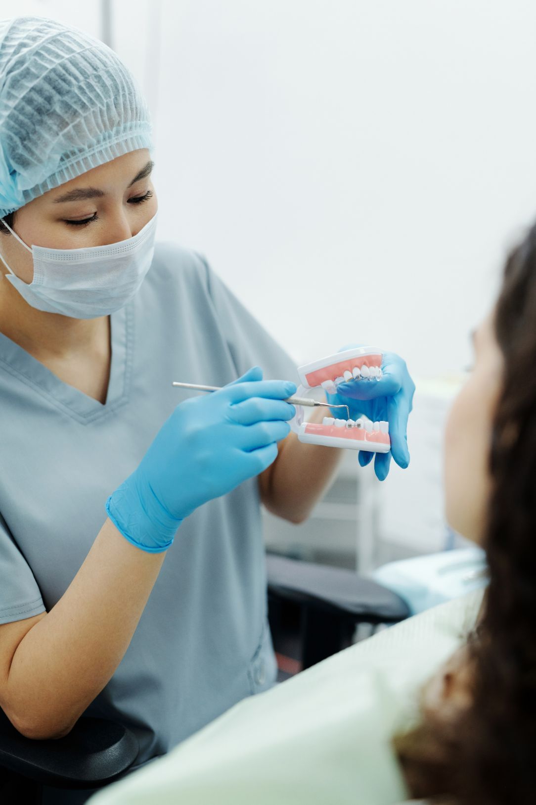 Dentist Holding Dental Mould — Dentistry Services in Cairns, QLD