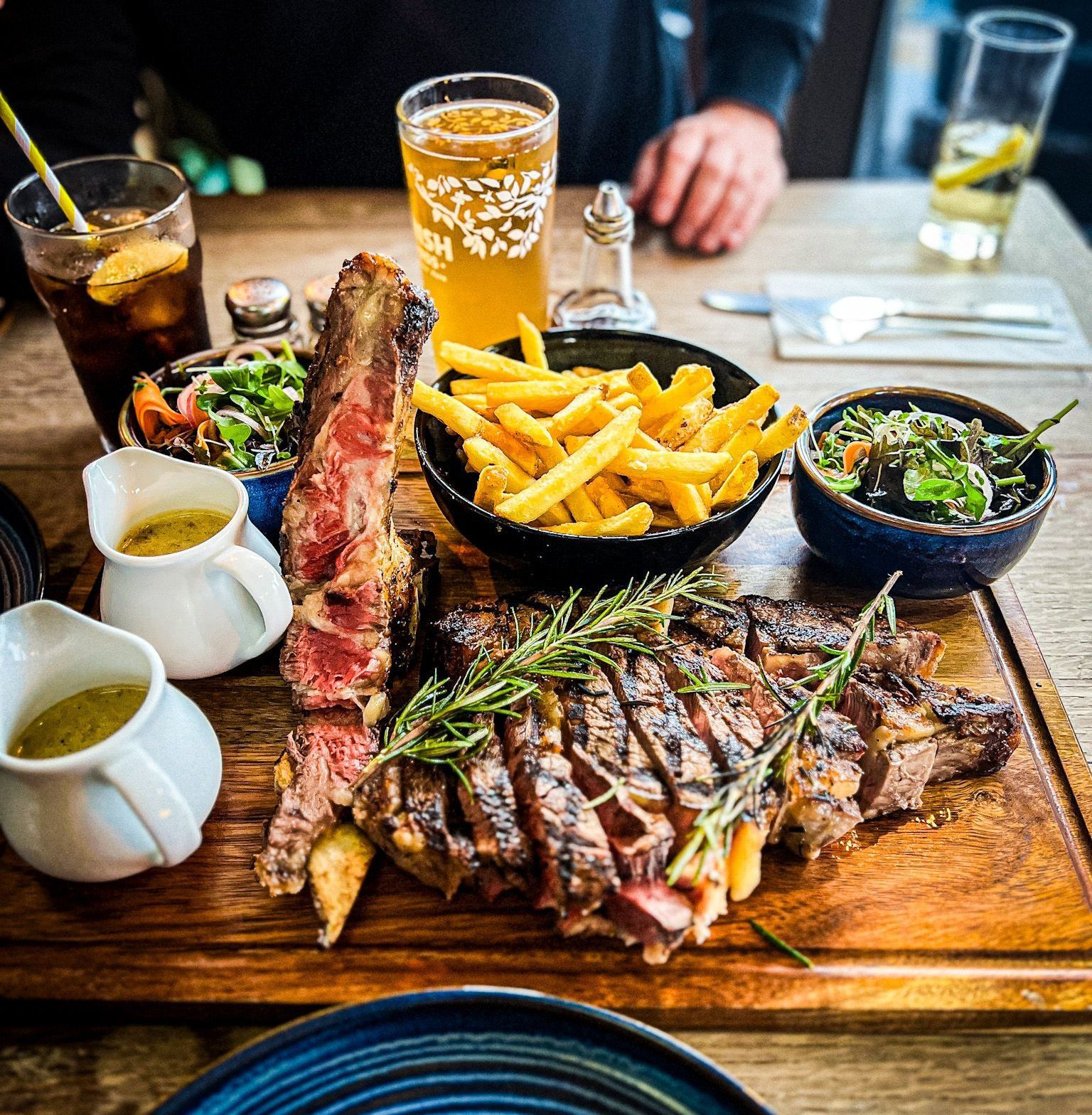 Côte de bœuf with fries, salad, and peppercorn sauce at The Point Exmouth.
