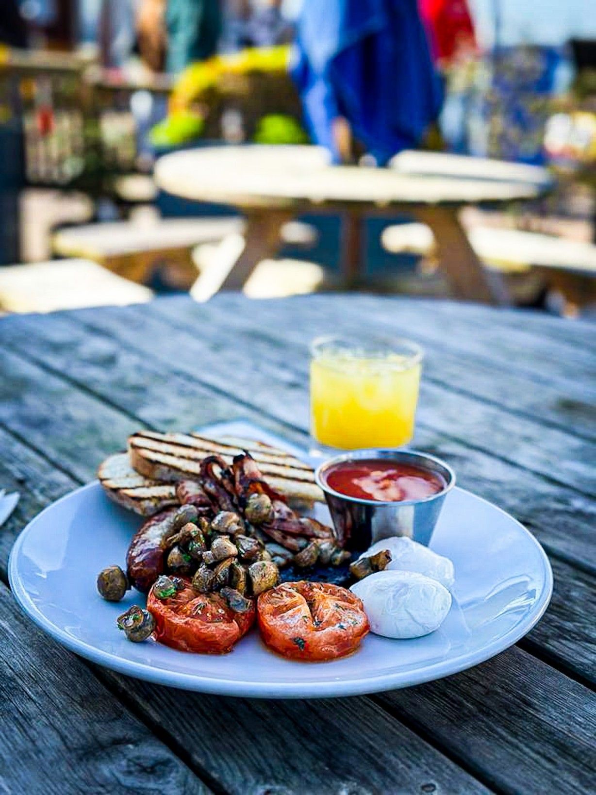 Full english breakfast by the sea, with orange juice.