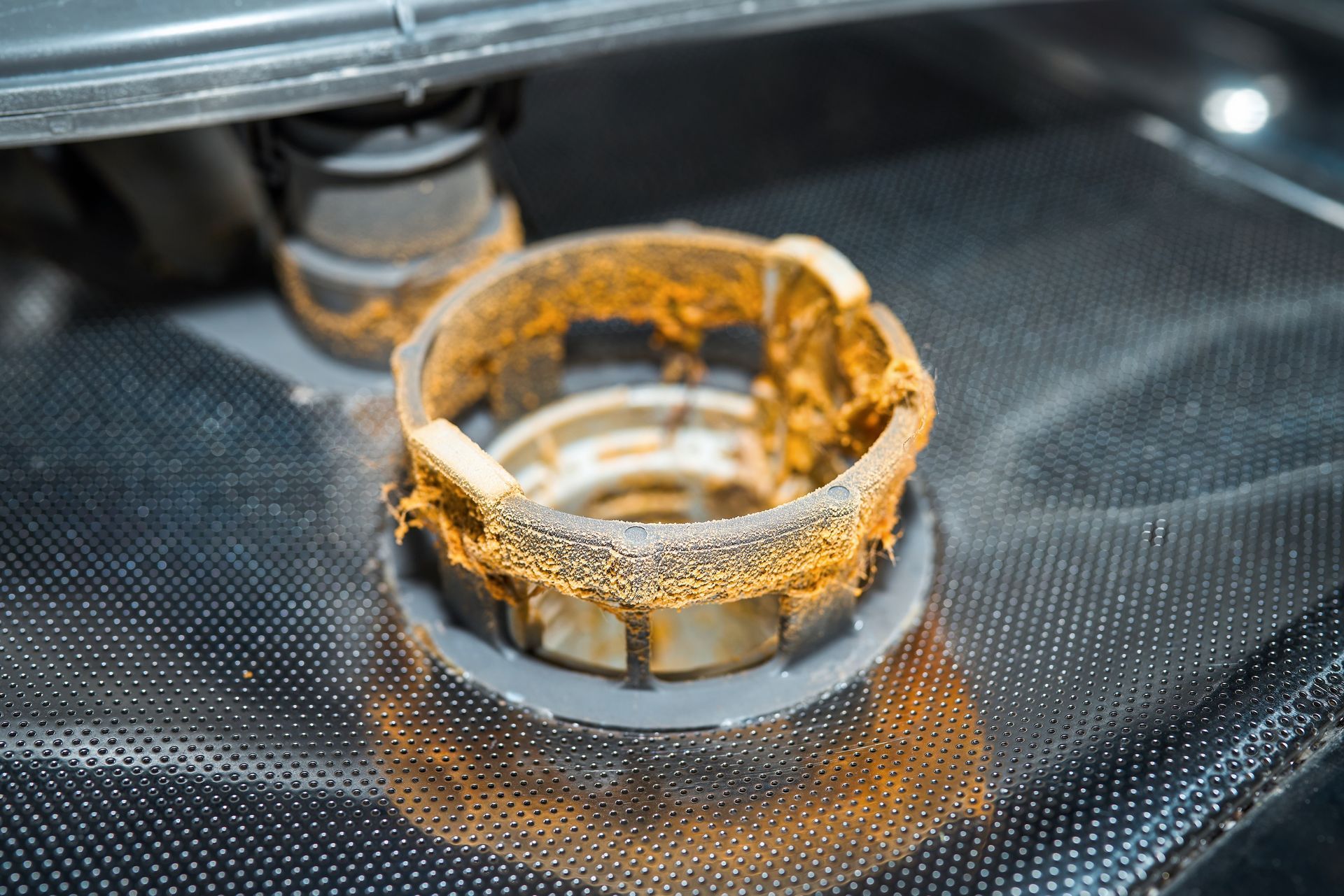 3D printer building a gold-colored ring on the print bed