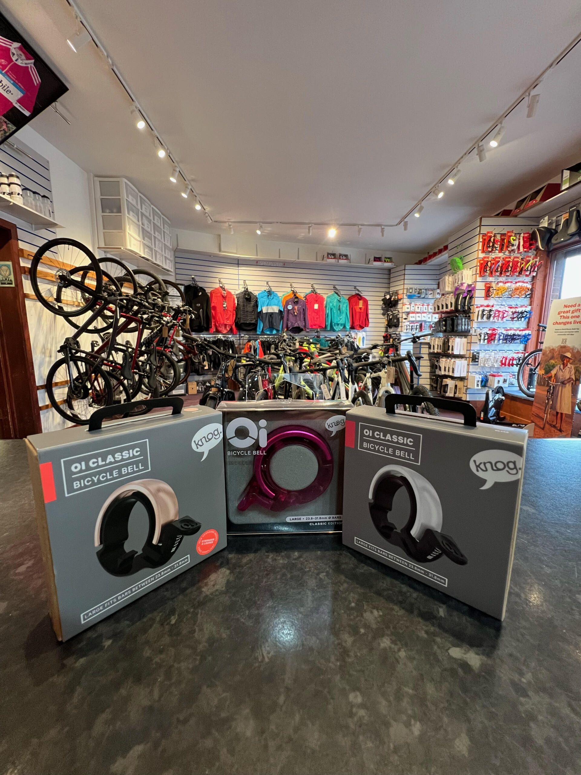 three knog bicycle bells are on display in a store
