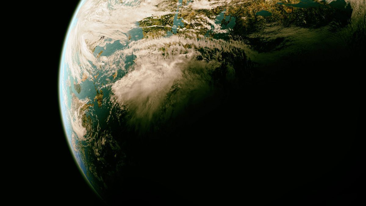 Earth from space showing cloud formations over green landmasses and blue oceans with sunlight illuminating the atmosphere