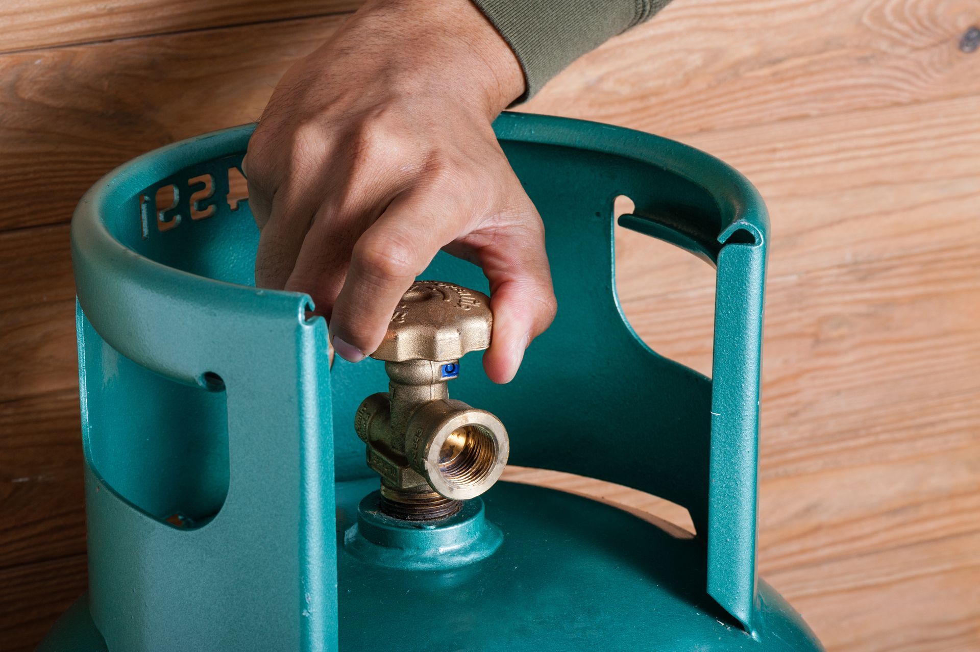 Hand Closing The Propane Gas — Middletown, NY — Blue Flame Propane