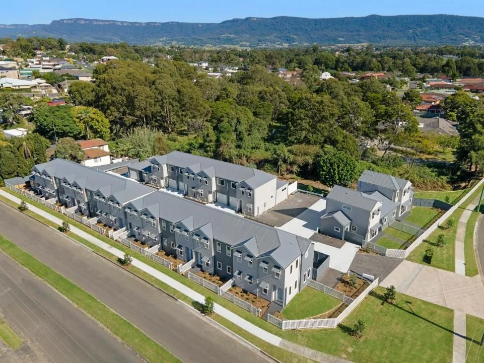 An Aerial View of a Row of Houses in a Residential Area — Sheps Roofing Service Pty Ltd In Albion Park Rail, NSW
