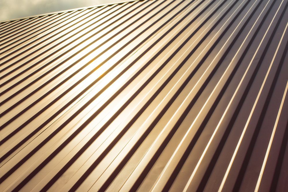 The Sun is Shining Through the Roof of a House — Sheps Roofing Service Pty Ltd In Albion Park, NSW