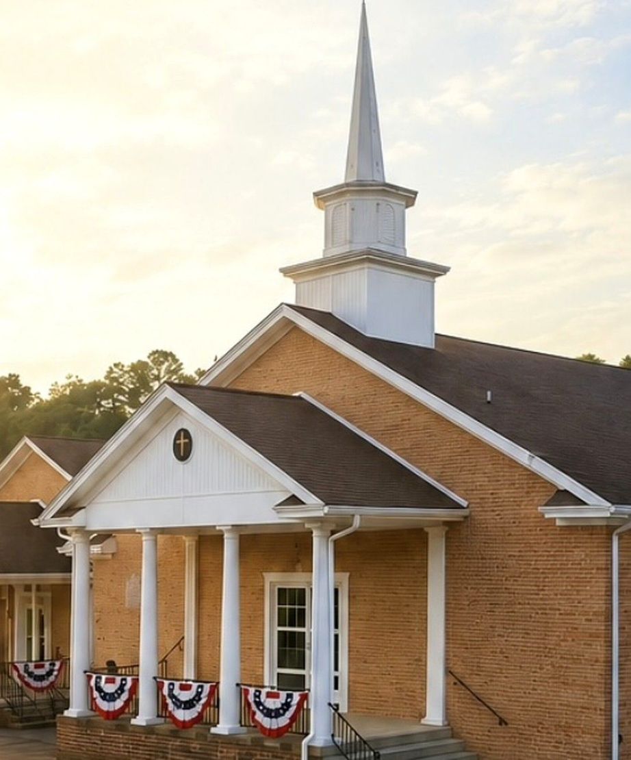 French Broad Valley Baptist Church building with white steeple in Kodak, Tennessee