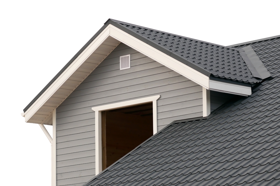 Gray gable roof with white trim and a vent.