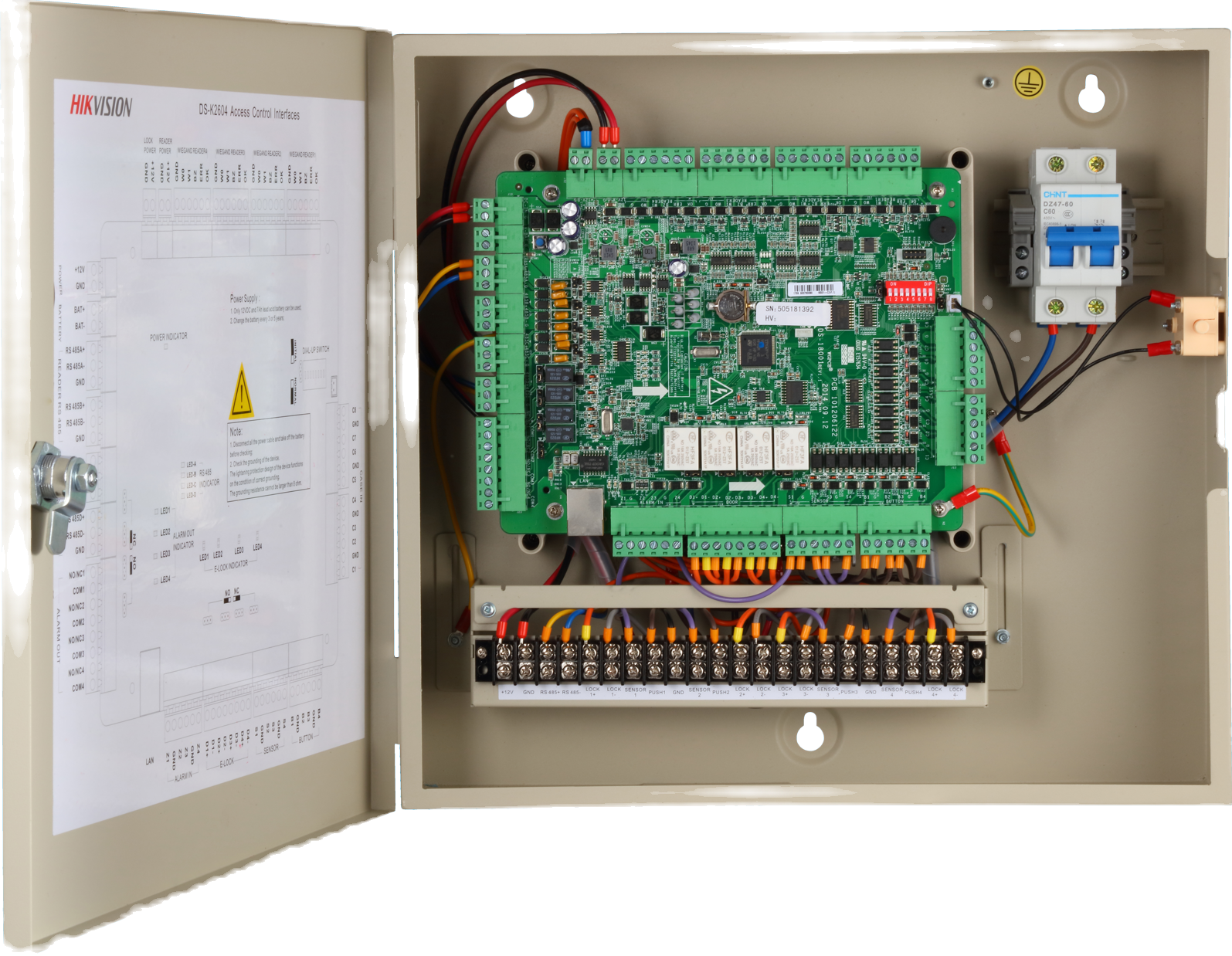 Open metal box revealing electronic circuit board, wiring, and a circuit breaker. Includes a hinged door with a diagram.