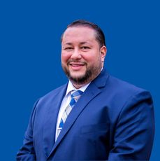 Headshot of Alex Lugo.