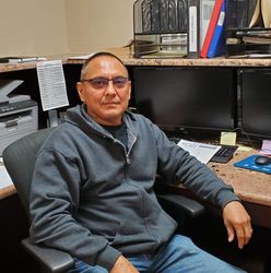 EULOJIO DIAZ Eulojio Diaz, sitting at a desk.
