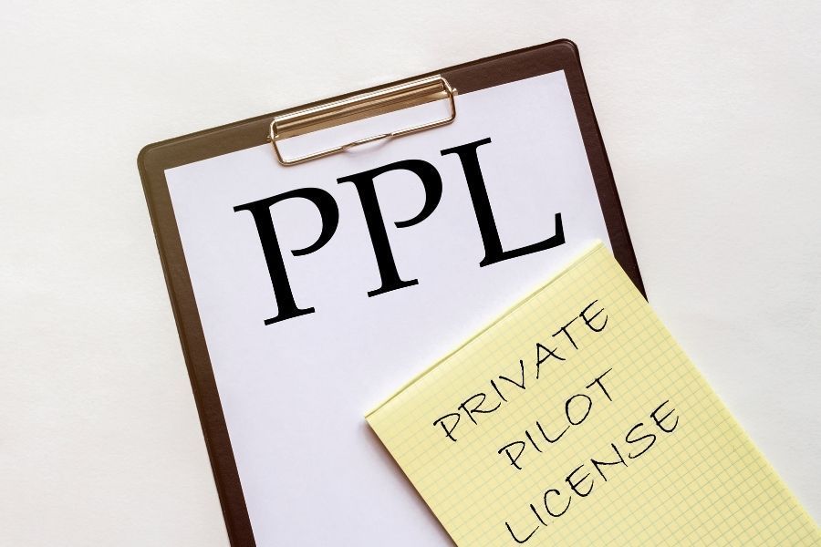 Private Pilot License paperwork on clipboard representing pilot training requirements.