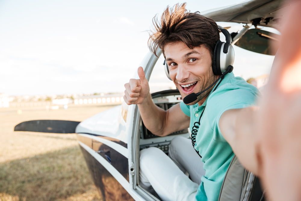 a private pilot giving a thumbs up