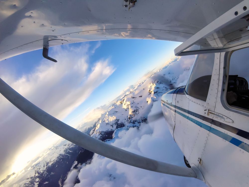 the small plane soaring through the clouds, demonstrating what is yaw