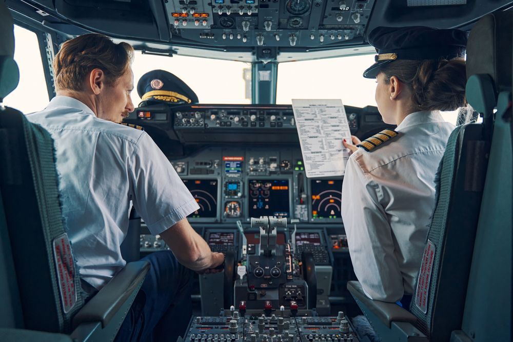 Pilots are checking off their pre-flight checklist.