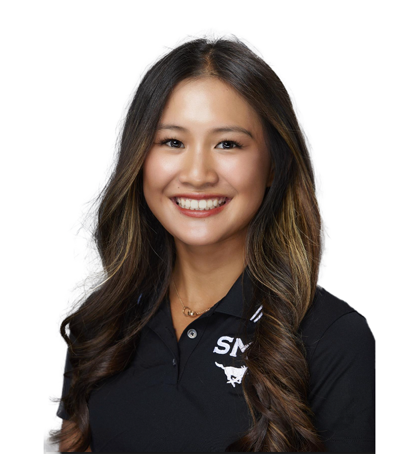 Smiling woman in a black polo shirt against a white background