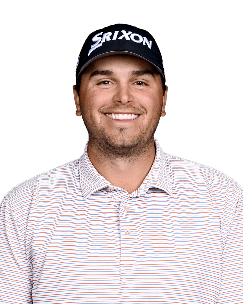 Smiling golfer in a black Srixon cap and striped polo against a white background