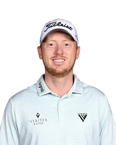 Man in a white Titleist cap and light blue striped polo smiling at the camera against a white background