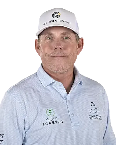 Man in a white cap and light blue golf shirt, facing forward against a plain background.