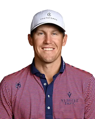 Smiling golfer in a white cap and red striped polo shirt against a white background
