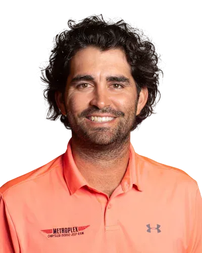 Smiling person in a coral polo shirt against a white background