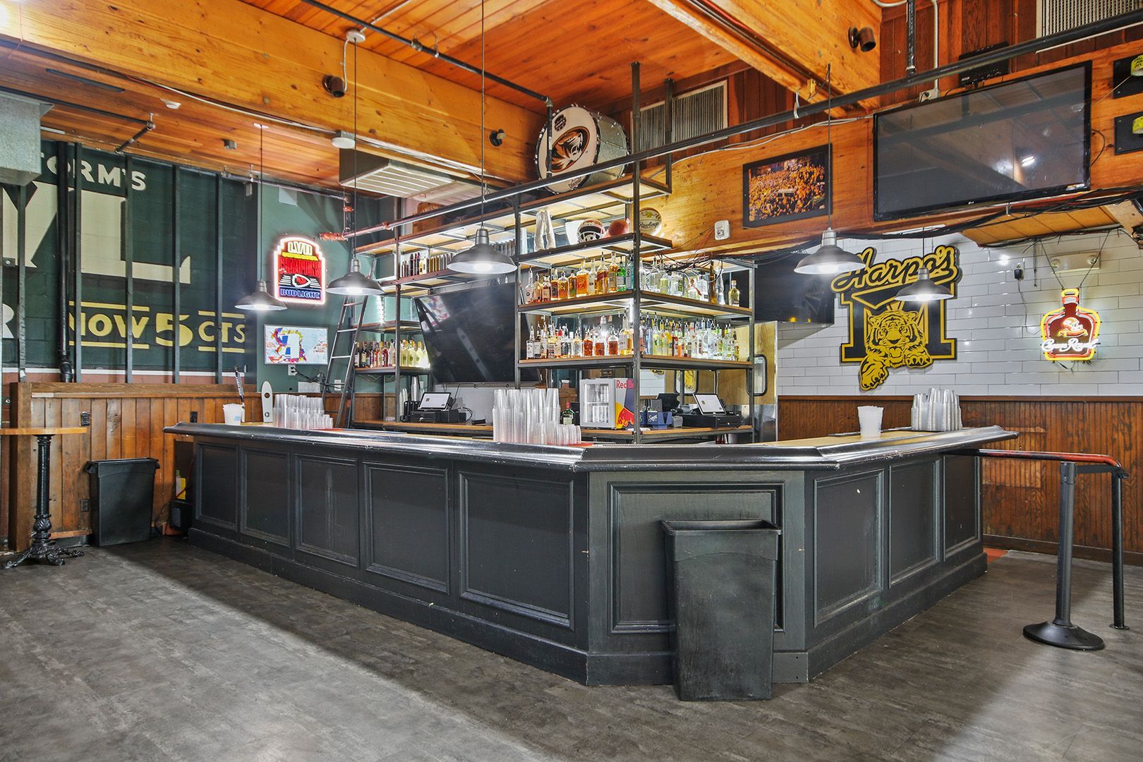 There is a long bar in the middle of the room.