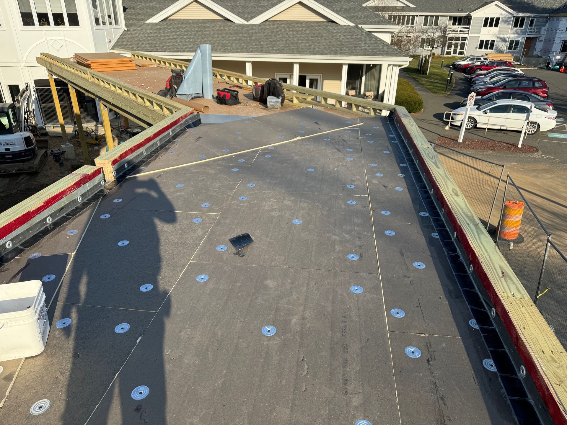 A roof is being installed on top of a building.