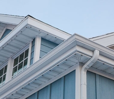 Close view of discreet permanent lighting installed beneath a home roofline