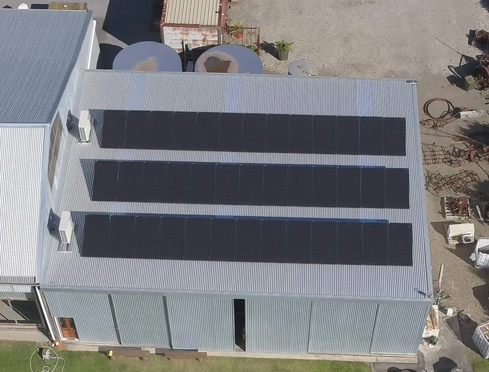 Solar Panels On A Gray Roof — 7E Integrated Services In Port Stephens NSW