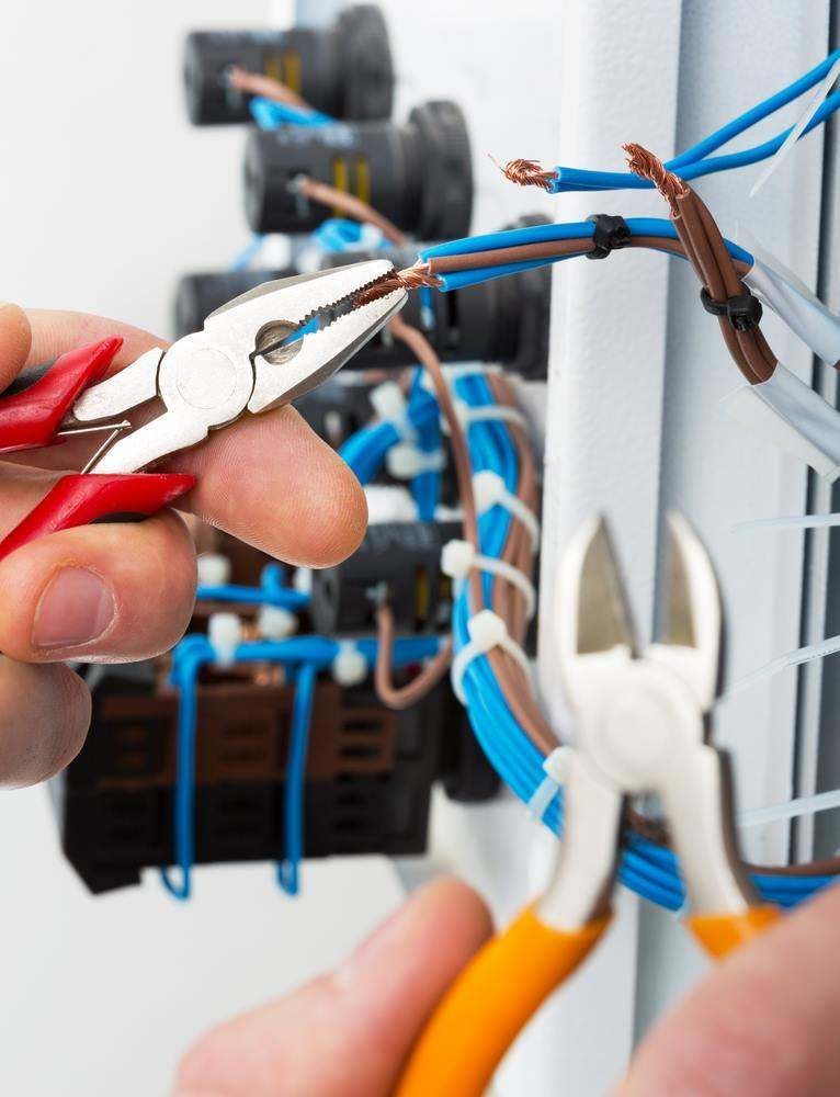 Electrician Maitland Working On Electrical Panel