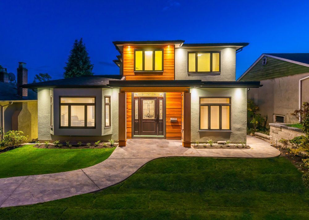 Large residental house at night with lighting all done by an electrican in maitland— 7E Integrated Services In Maitland NSW