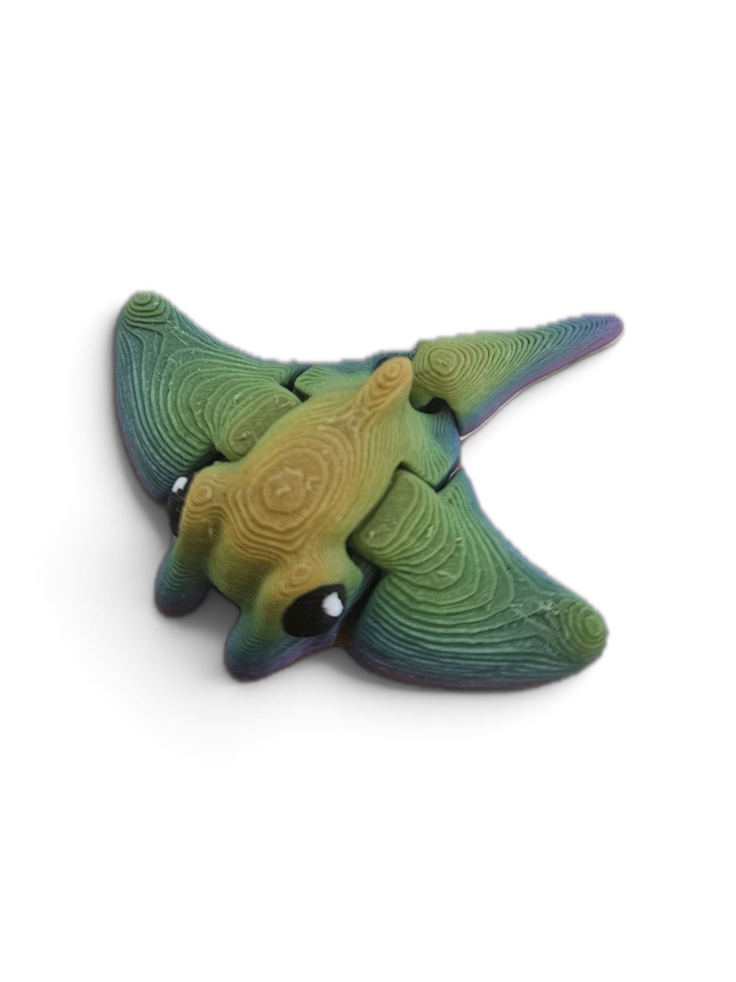 Colorful 3D printed horned turtle figurine with green, yellow, and purple gradient on a white background