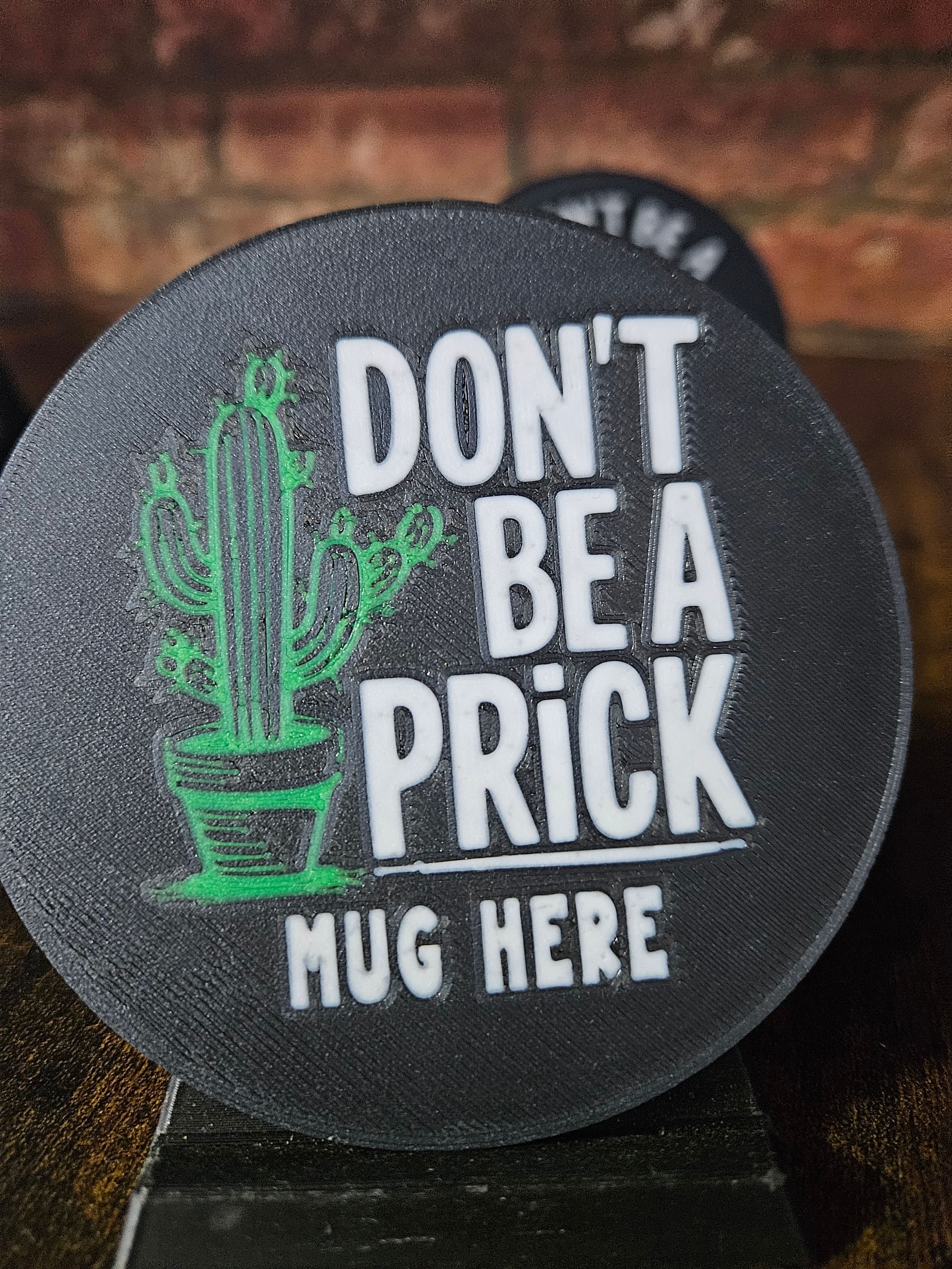 Black circular coaster with