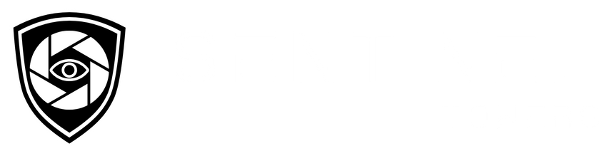 A black and white logo with a camera lens and an eye on it.