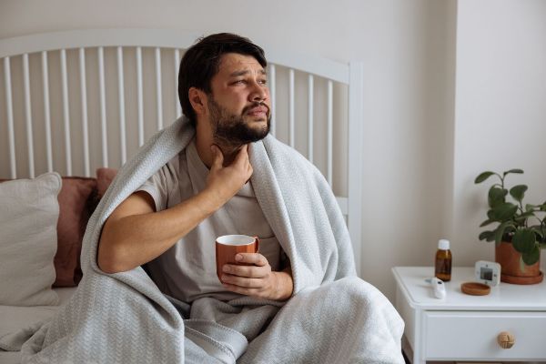 man with sore throat