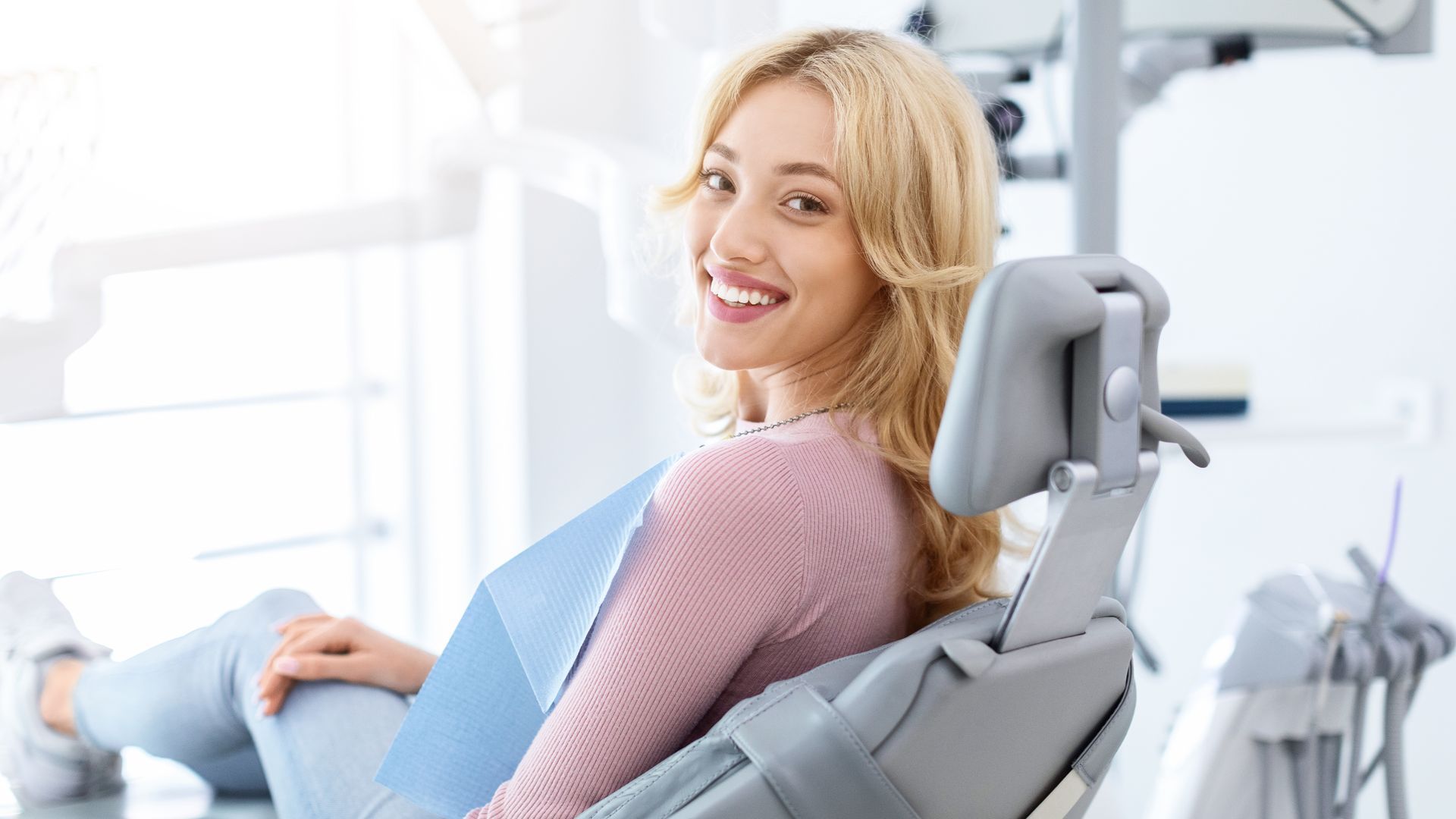 Smiling woman in dental chair after smile makeover at Clearwater Dentist in Clearwater FL