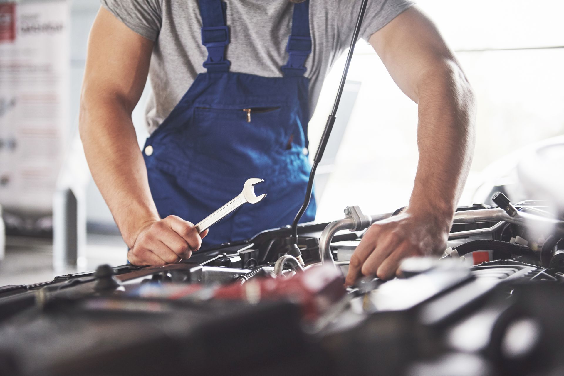 man working on engine | Kirkham Automotive Ltd