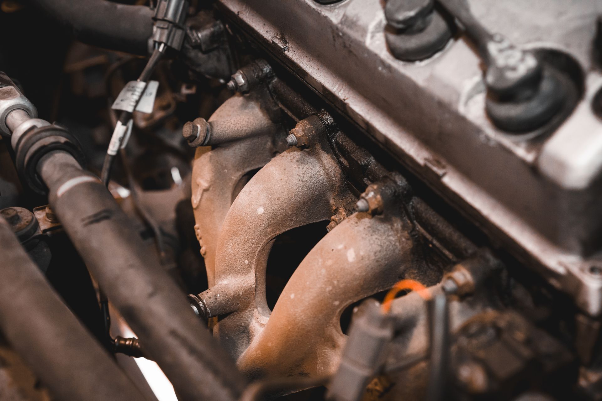 What Happens When an Oil Leak Reaches the Serpentine Belt or The Exhaust Manifold | Greg's Garage