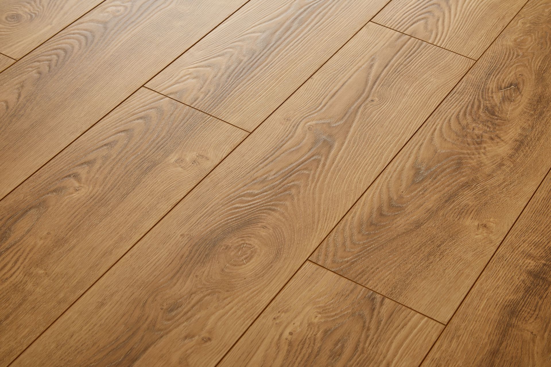 Light brown hardwood floor with diagonal wood grain planks
