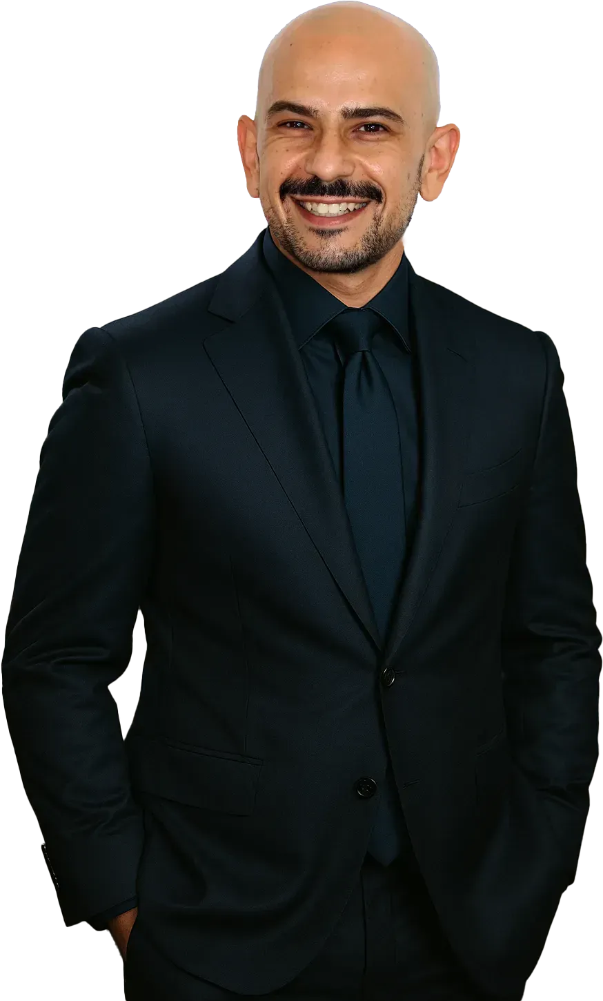 Smiling man in a black suit against a white background