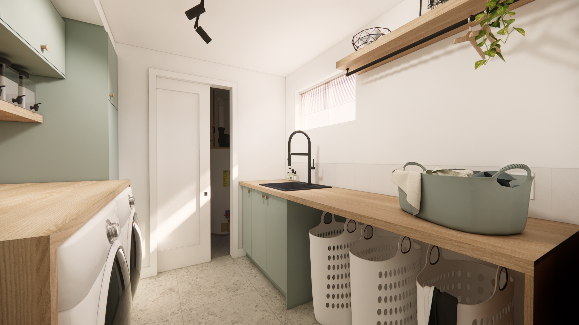 Buanderie avec placards verts, plans de travail en bois et paniers à linge suspendus.