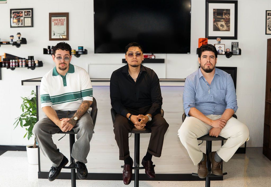 Goodfellas Barbershop team at the shop bar
