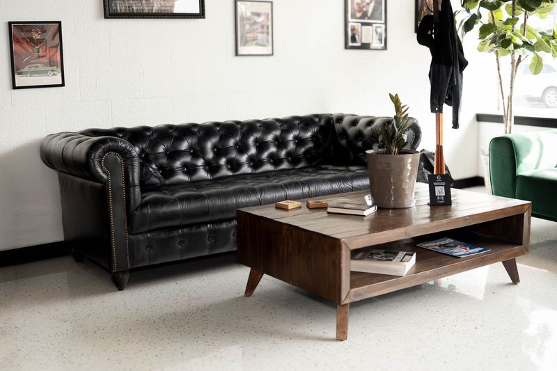 Customer seating area near the entrance at Goodfellas Barbershop