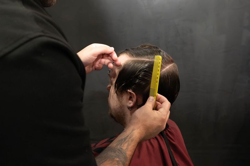 Barber preparing for a shear cut at Goodfellas Barbershop