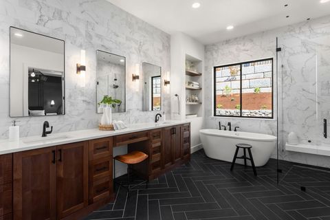 a bathroom with two sinks and a bathtub