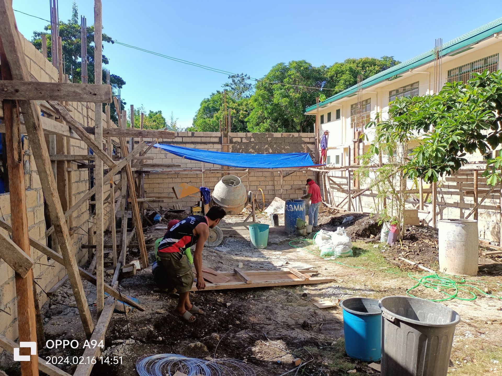 A group of people are working on a construction site.
